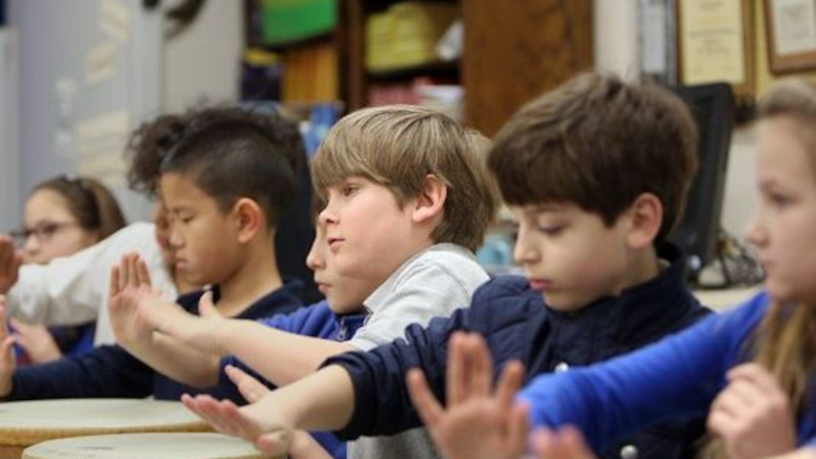 In this 2016 photo, students play tubanos during music class at the University of Memphis Campus School. The university wants to add a middle school.