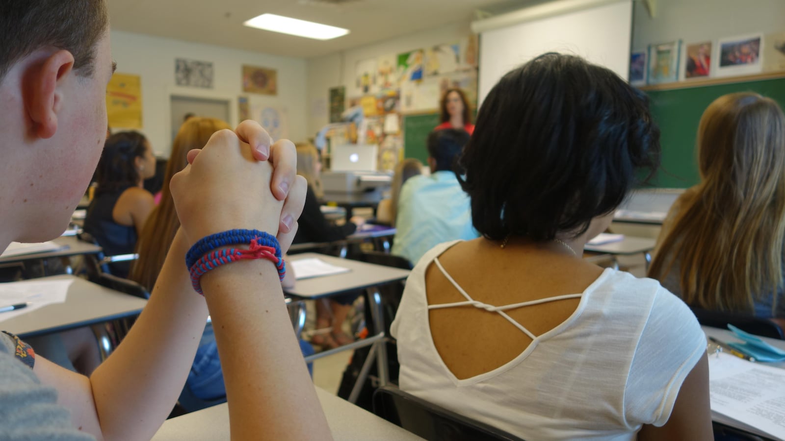 Students in Spanish IV discuss their goals for the year at Arlington High School on the first day of school.