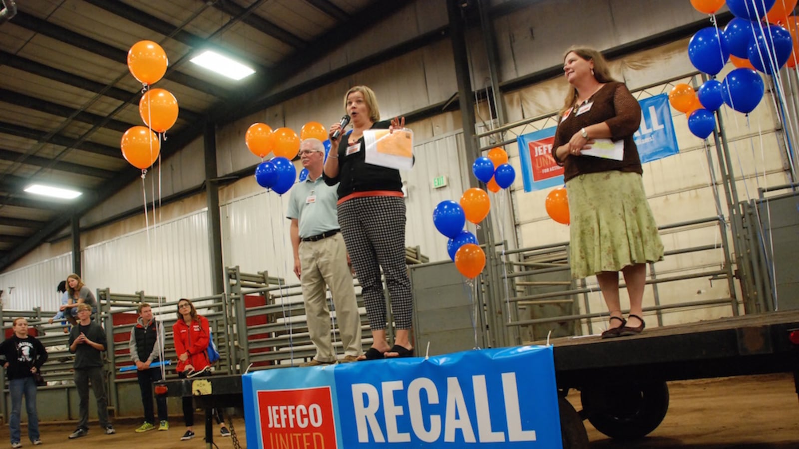 Organizers of a school board recall effort in Jefferson County, from left, Michael Blanton, Wendy McCord, and Tina Gurdikian, spoke at the campaign kick off event in July.