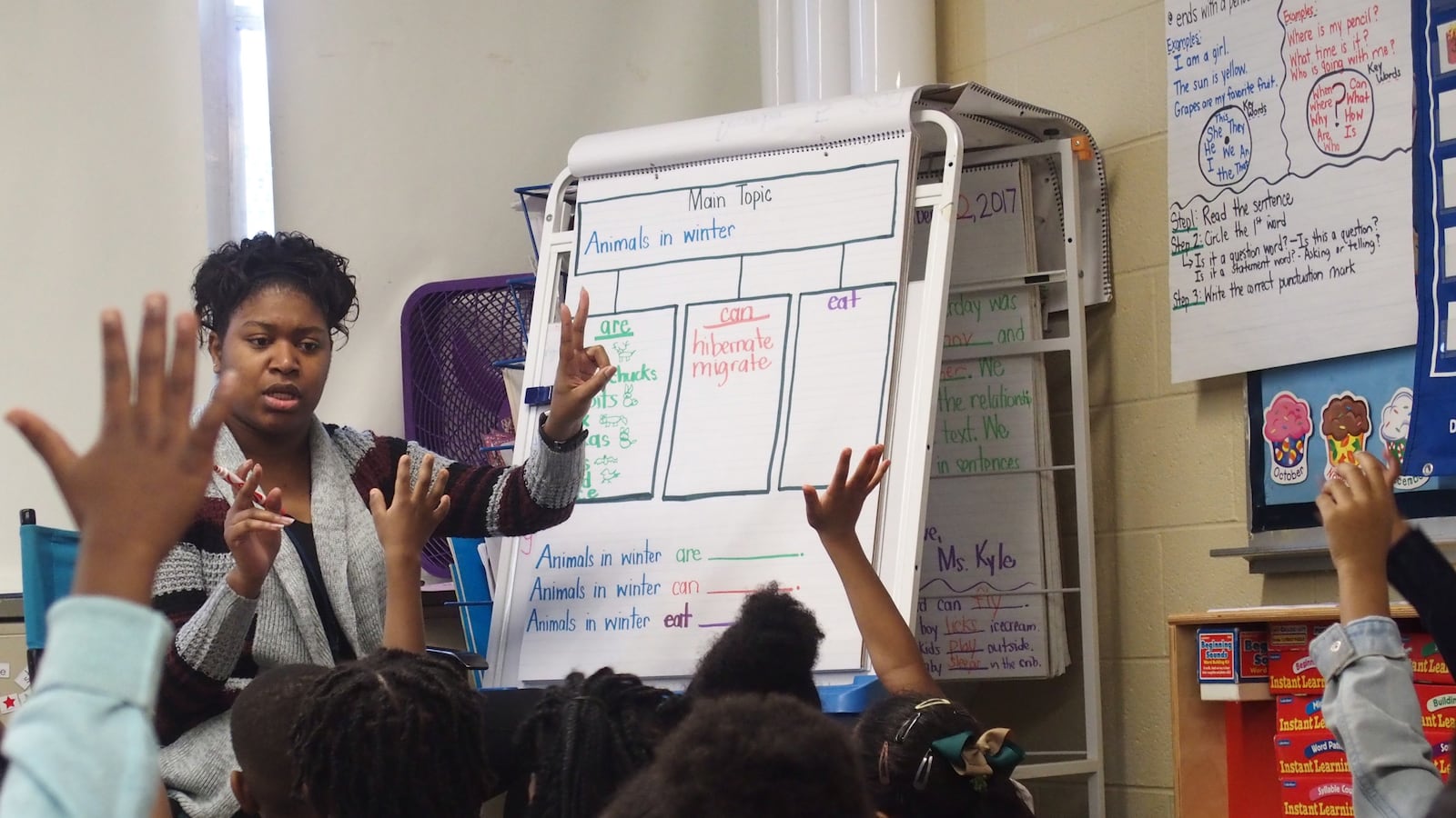 A teacher for Shelby County Schools calls on a student.