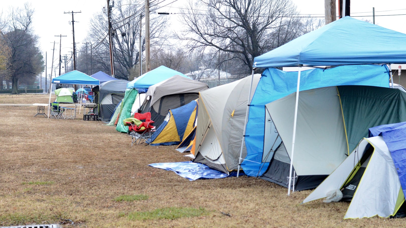 Tents line the grounds outside of Shelby County Schools' central office in 2016 in Memphis, where parents have camped out every January in recent years to apply for select optional schools. The application process moves completely online in 2018.
