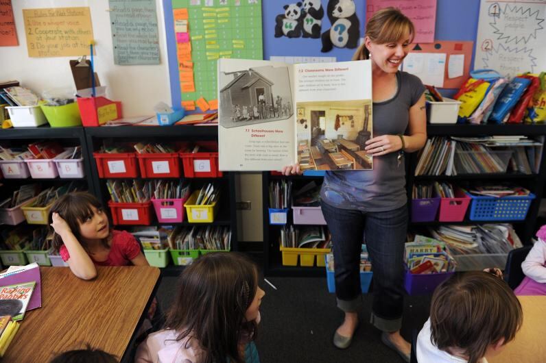 Teacher Haiti Johnson fields questions from students in her social studies class at Teller Elementary School in Denver.