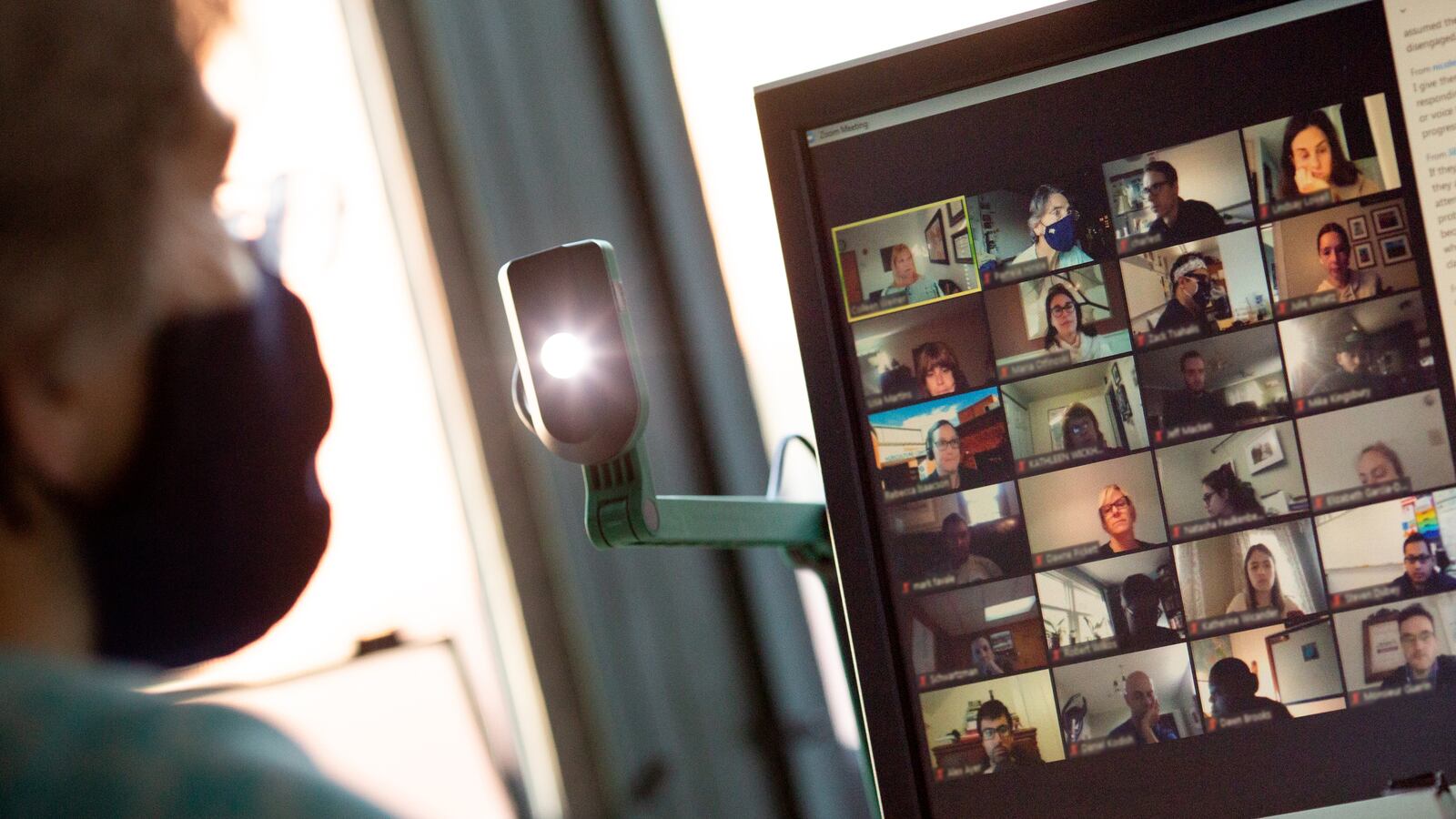 Teacher Pamela Hinkle participates in a staff meeting alone in her classroom via zoom