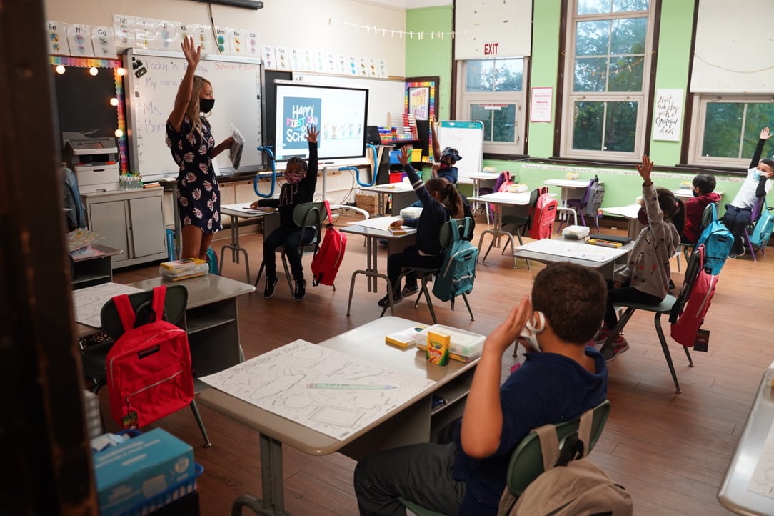 First and second graders at Harms Elementary School learn about COVID safety on the first day of classes, Sept. 8. The Detroit district announced Thursday it is suspending in-person classes until January.