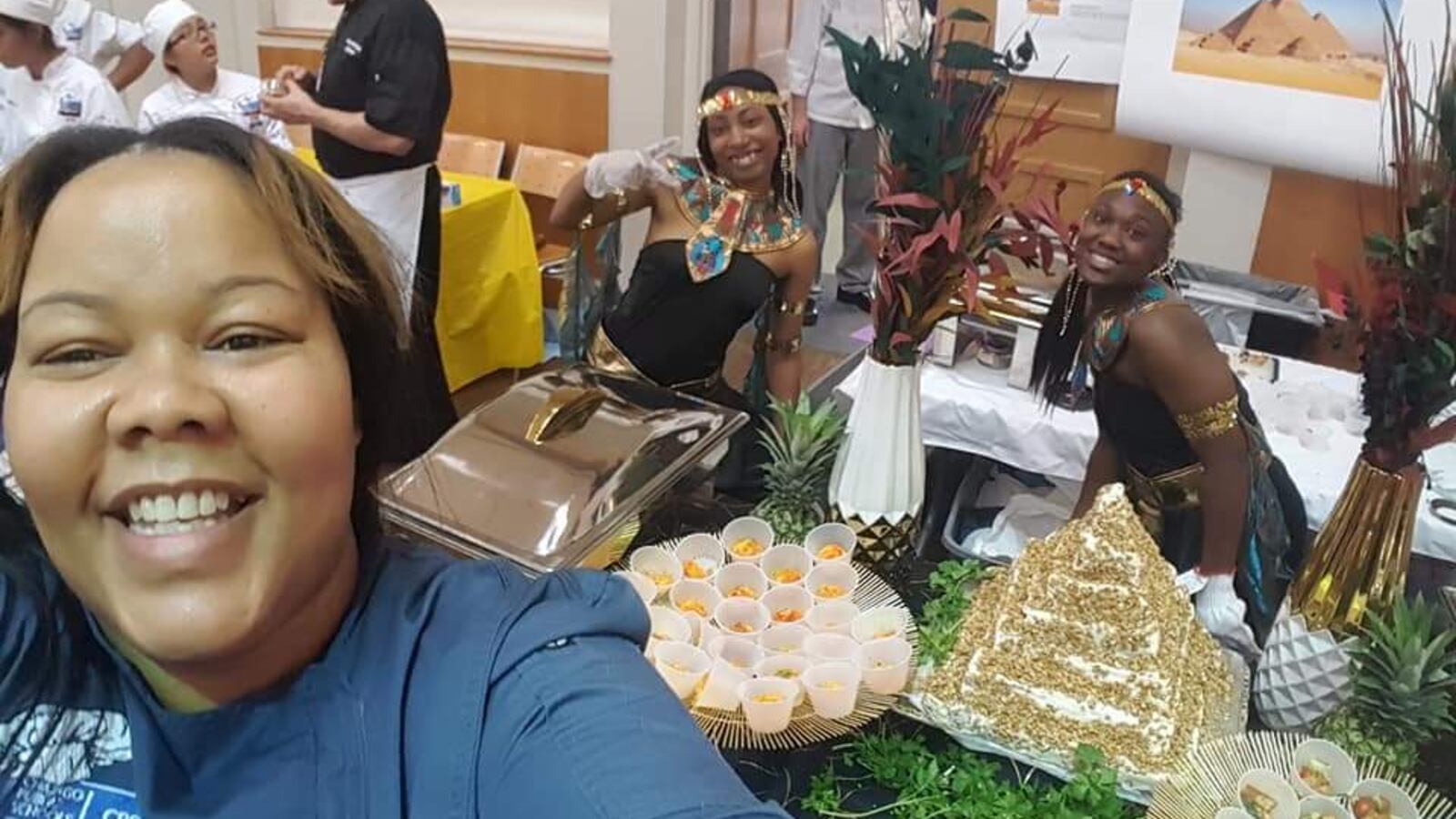 Golden Apple Award finalist Athenia Travis takes a selfie with her culinary arts students at Southside Occupational Academy. She and her students sometimes prepare meals from cultures across the world for the whole school to enjoy.