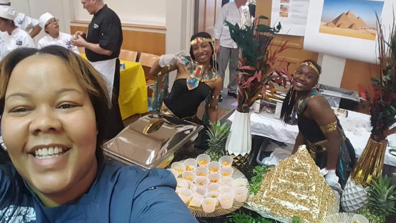 Golden Apple Award finalist Athenia Travis takes a selfie with her culinary arts students at Southside Occupational Academy. She and her students sometimes prepare meals from cultures across the world for the whole school to enjoy.