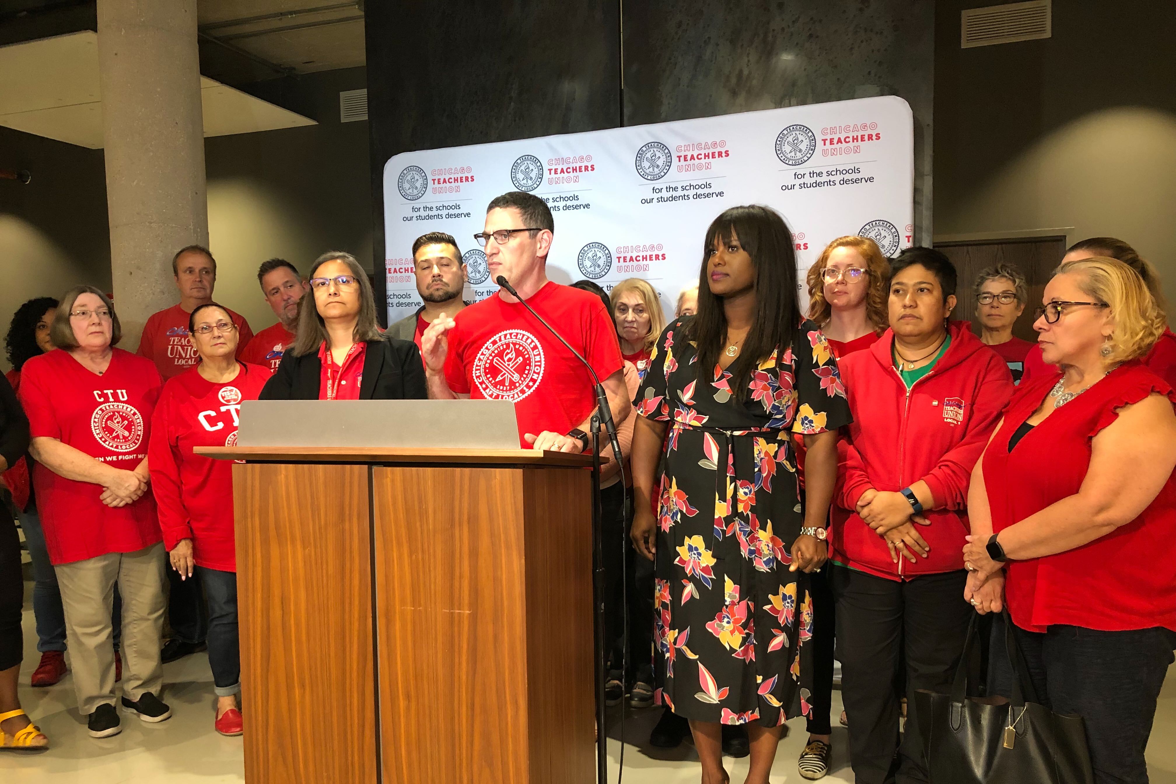 Chicago Teachers Union President Jesse Sharkey and Vice President Stacy Davis Gates announce the results of a strike vote Thursday night at union headquarters.