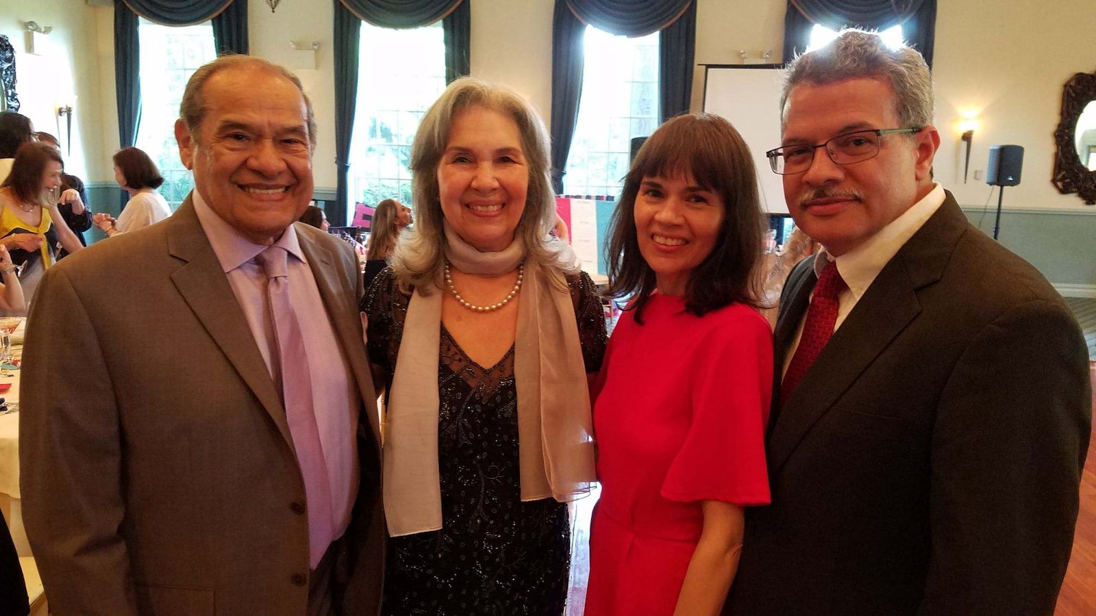 Elizabeth Mendoza, second from left, with family members at her retirement party.