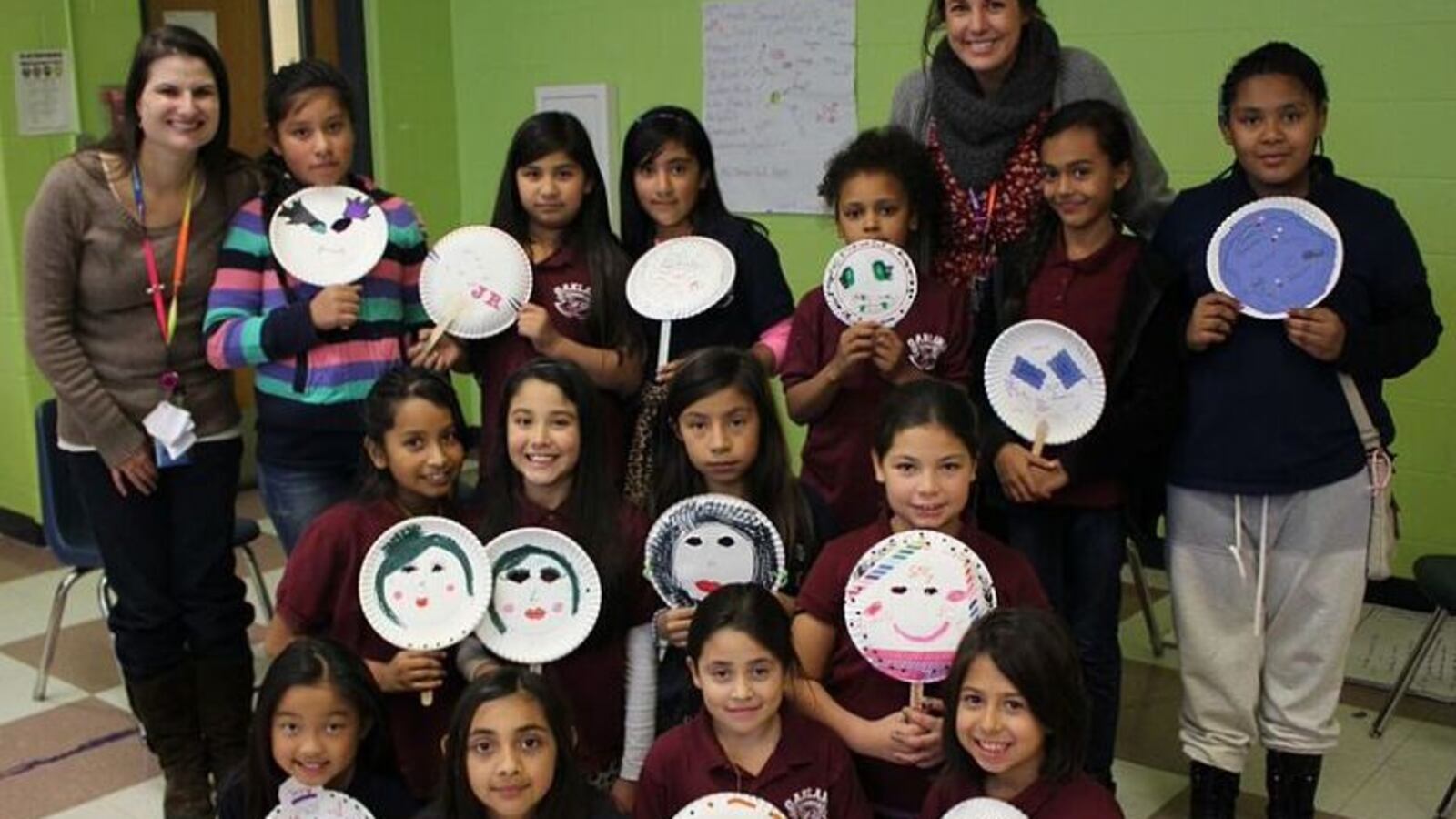 Students at Oakland Elementary hold up masks they decorated to represent who they are on the inside. The activity was part of one of the school's preventative programs for girls. (Photo courtesy of Oakland)
