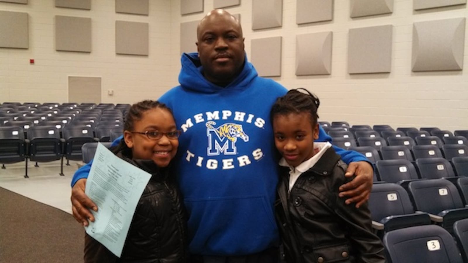 Kenneth Woods and his daughters Breanna Rosser (r) and Taylor Woods (r) reviewed 12 powerful words with sixth grade language arts teacher Patricia Hervey.