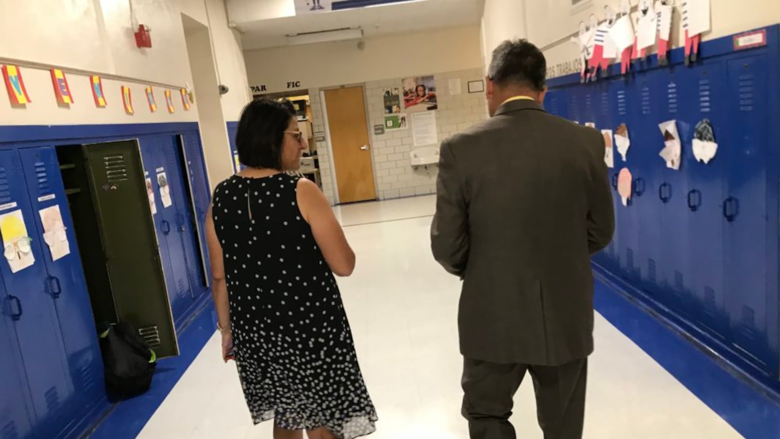 Former interim Denver superintendent Ron Cabrera, right, walks down a hallway with Stedman Elementary Principal Greta Martinez in September 2018.