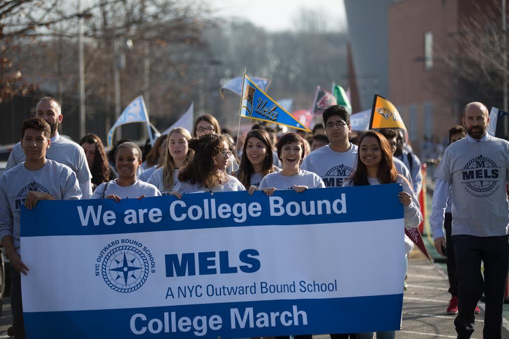 MELS students marched last December to celebrate their college acceptances.