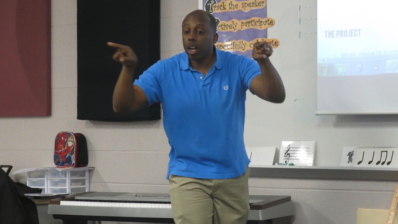 Christopher Blackmon leads second-grade students in a song he wrote and composed as a music teacher at Thomas Edison Elementary School in Nashville.