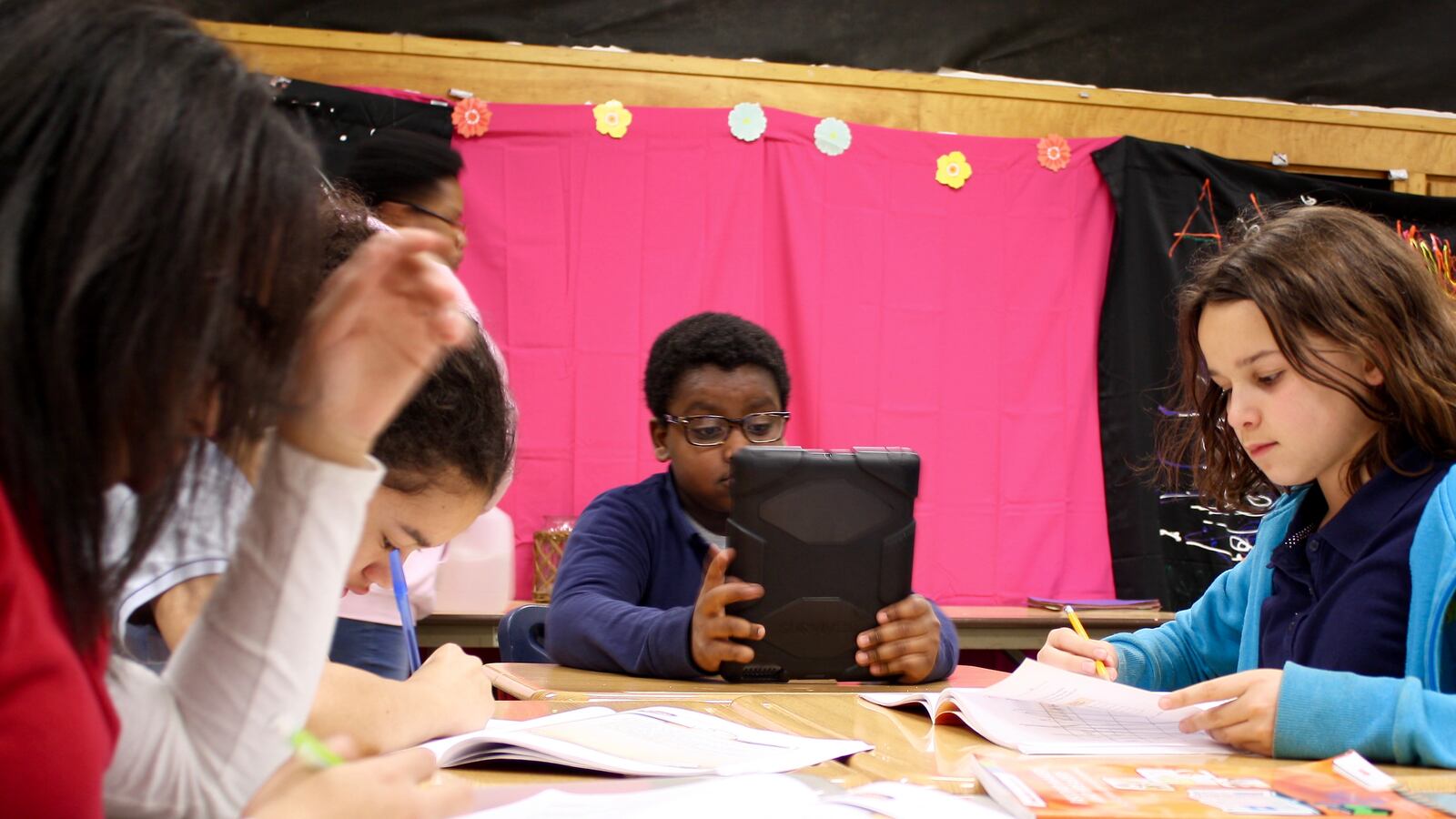 Students at Sidener Academy in Indianapolis Public Schools read or do homework.