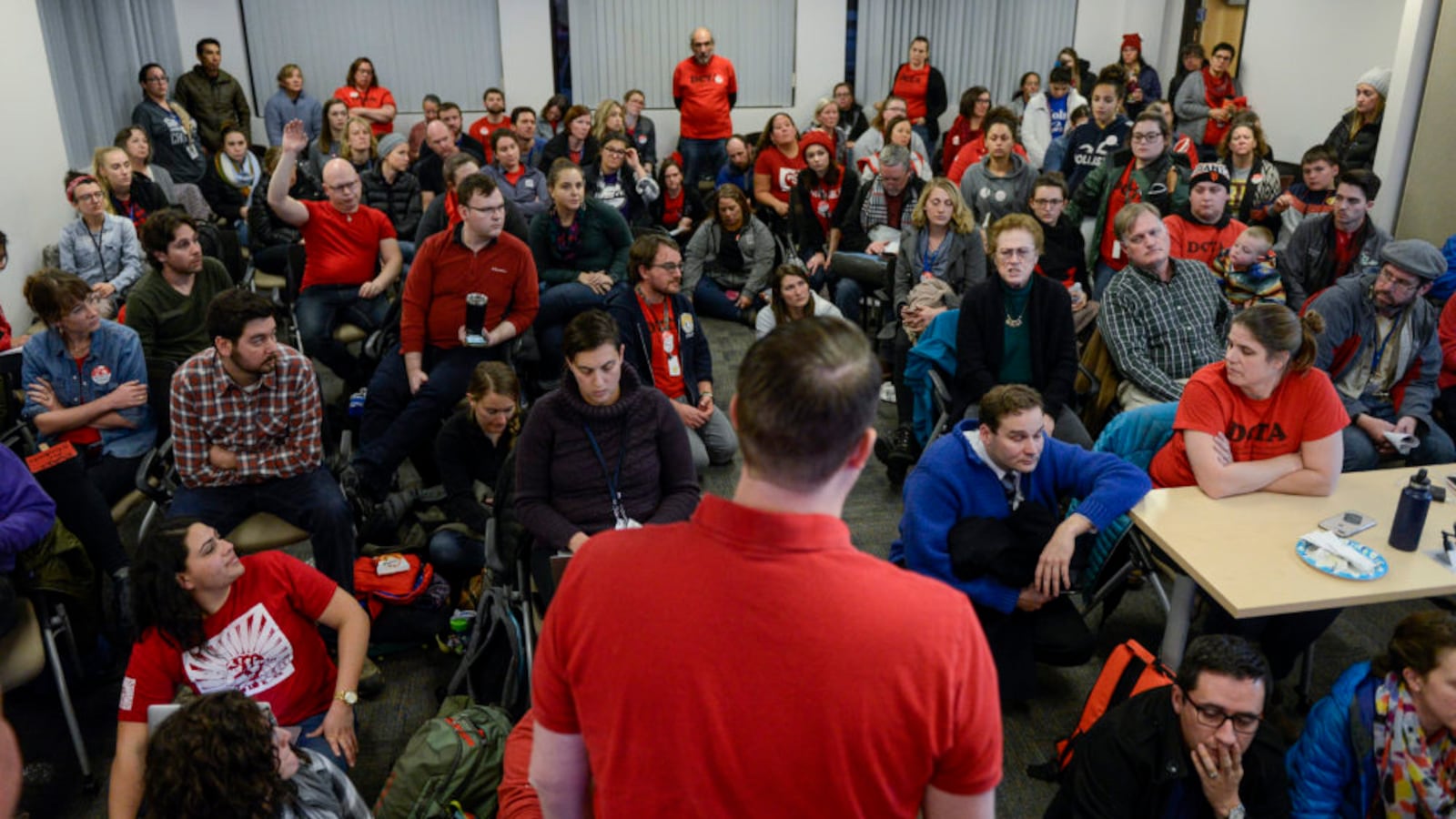 Denver Classroom Teachers Association deputy executive director Corey Kern speaks to a room full of teachers during a break in negotiations between the union and and Denver Public Schools in January.