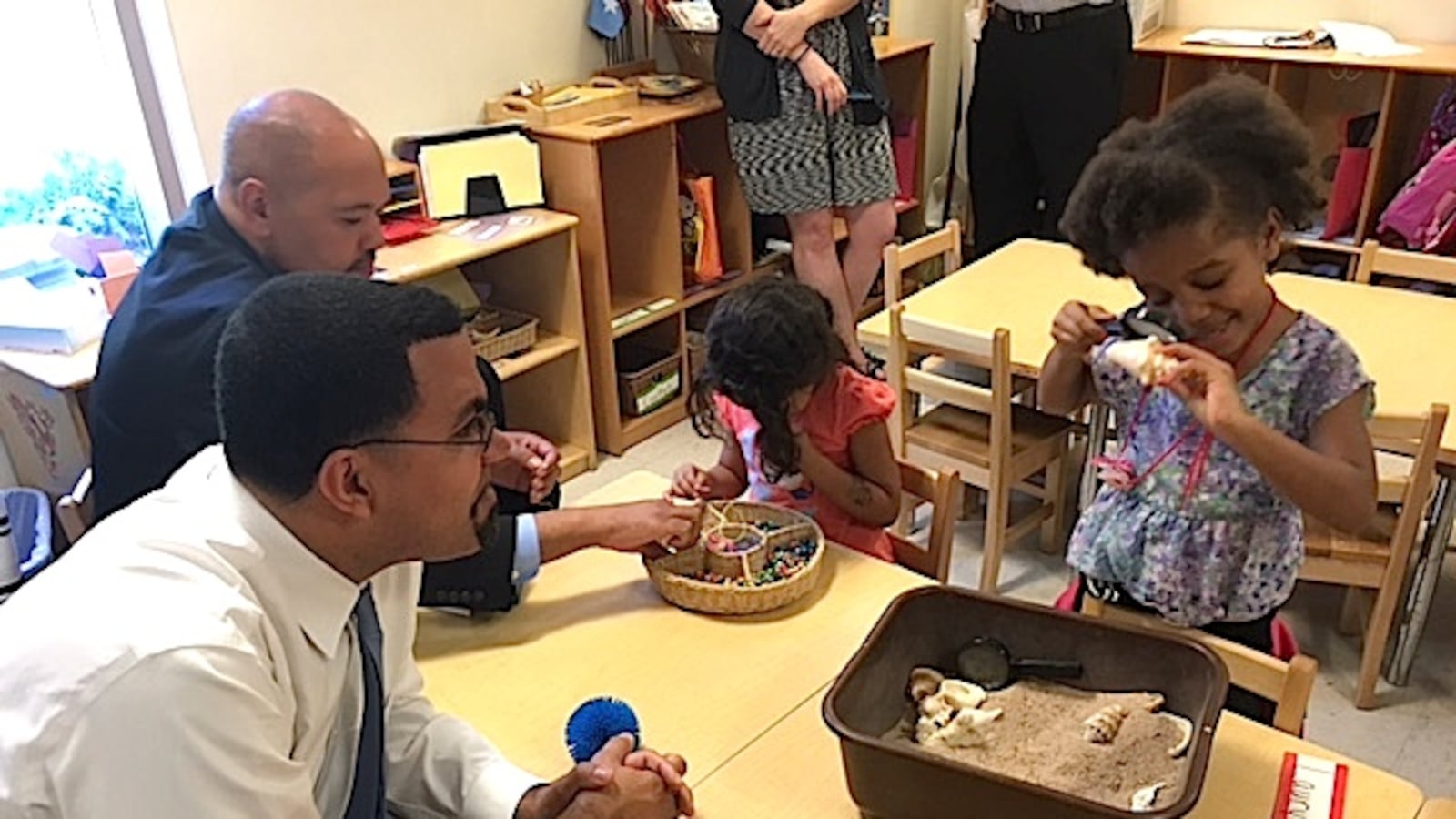 U.S. Secretary of Education John King interacts with children at the Mile High Learning Center.