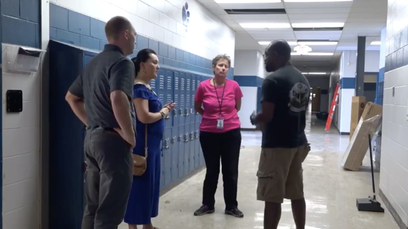 Shelby County Schools employees tour Kirby High School during repairs. District officials announced Thursday that the school would remain closed due to a pest infestation.