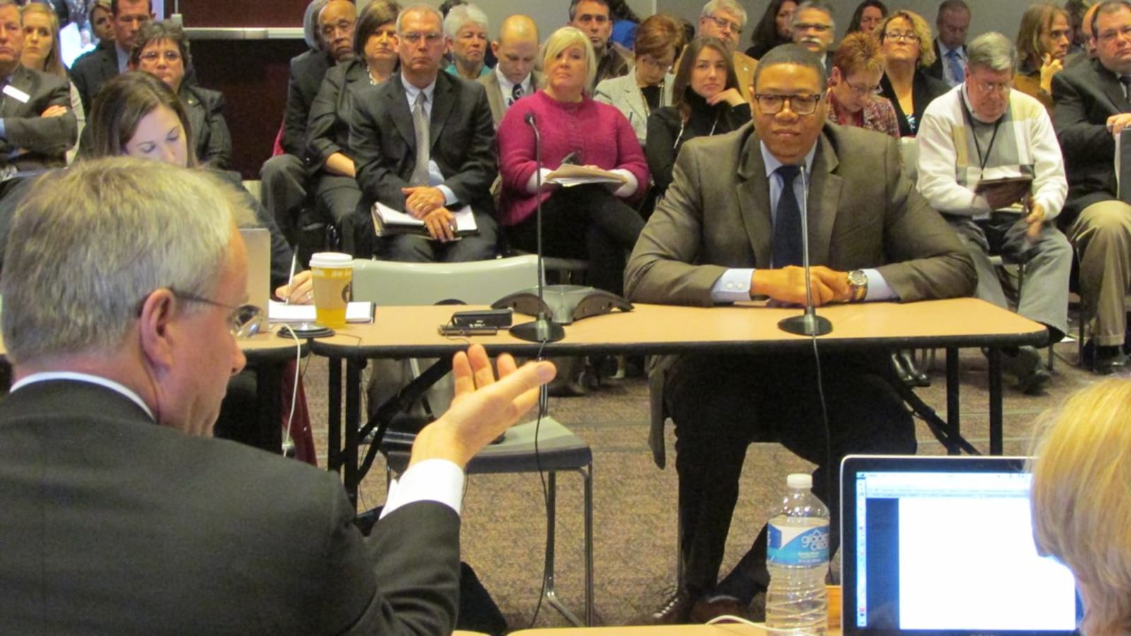 State Board of Education member Dan Elsener asks questions of  IPS Superintendent Lewis Ferebee at a board meeting last year.