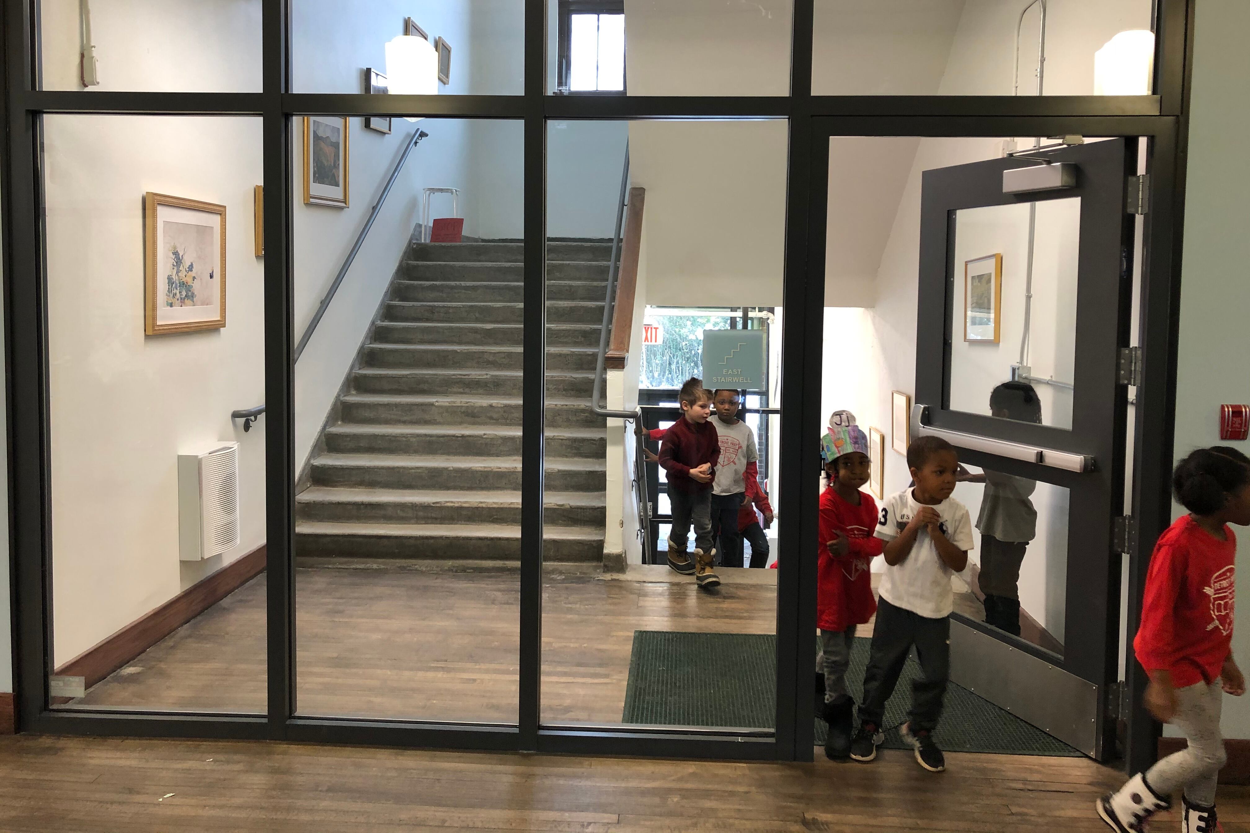 Students walk through the hallways at Detroit Prep, a charter school that is among more than 800 K-12 schools in the state that must close to slow the spread the coronavirus.