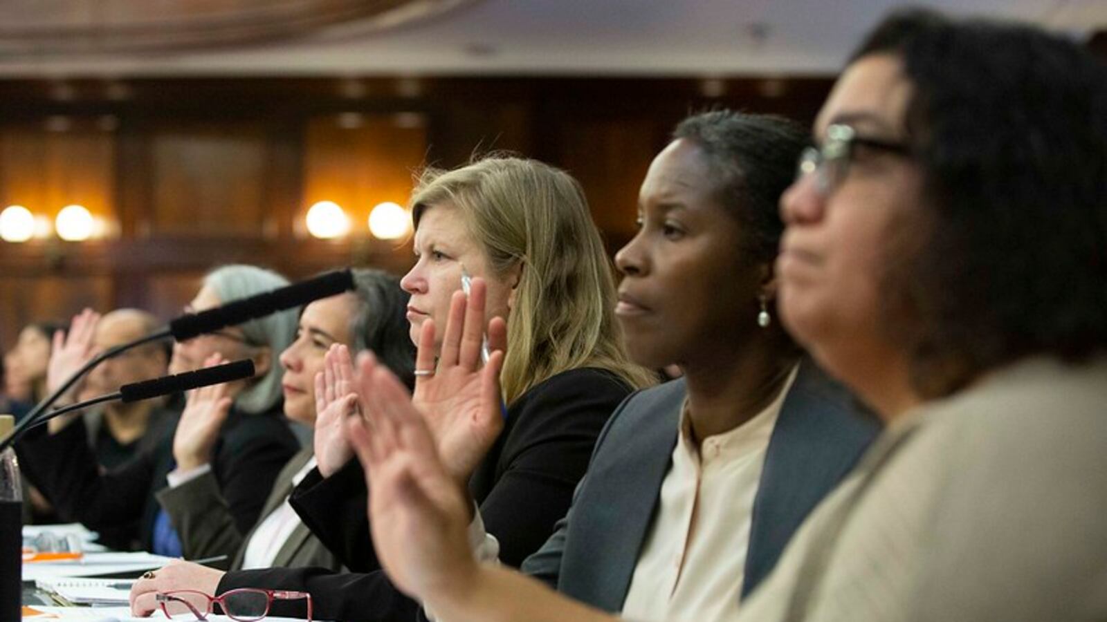 City health officials are sworn in for a City Council oversight hearing on lead laws and regulations, including those that govern inspections in schools.