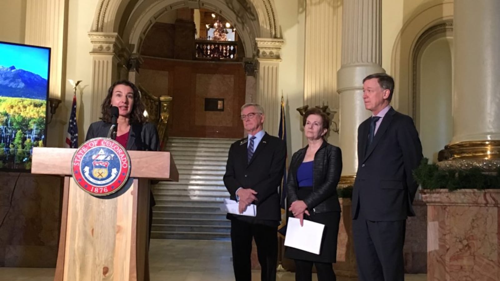 Colorado Education Commissioner Katy Anthes stressed that a new education blueprint respects local control, as state Rep. Bob Ranking, Lt. Gov. Donna Lynne, and Gov. John Hickenlooper look on.
