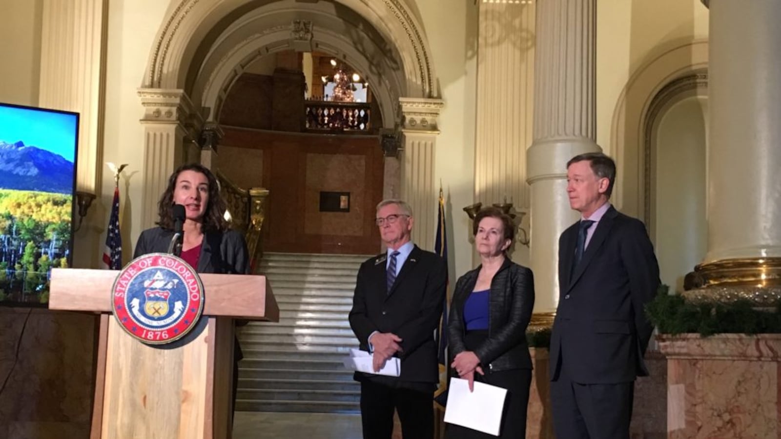 Colorado Education Commissioner Katy Anthes stressed that a new education blueprint respects local control, as state Rep. Bob Ranking, Lt. Gov. Donna Lynne, and Gov. John Hickenlooper look on.