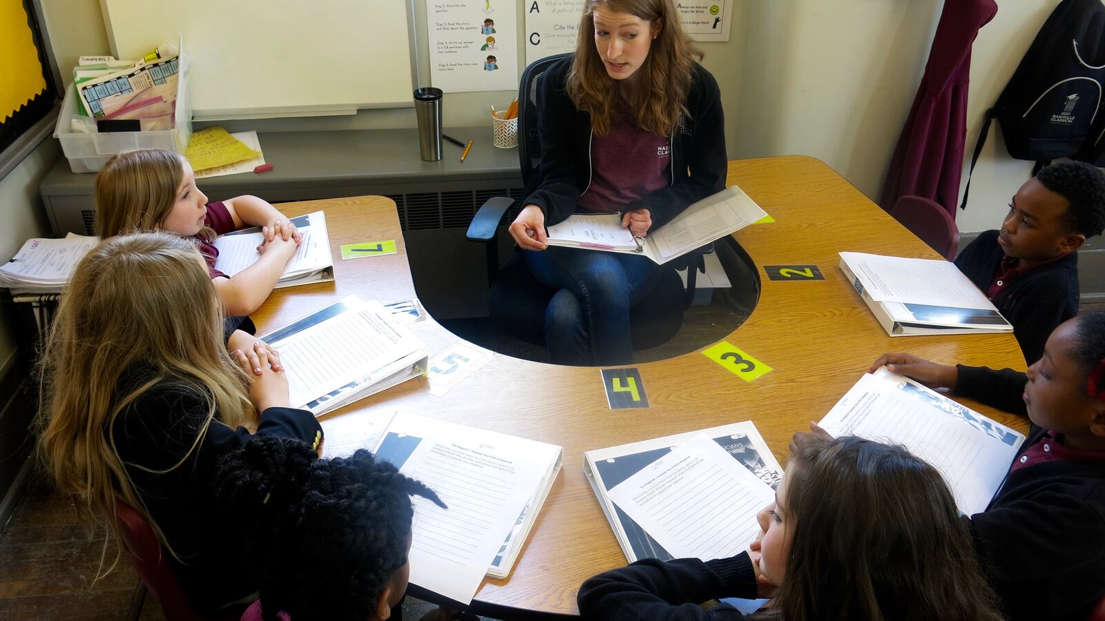 Kathleen Cucci reads aloud to her students during group time.