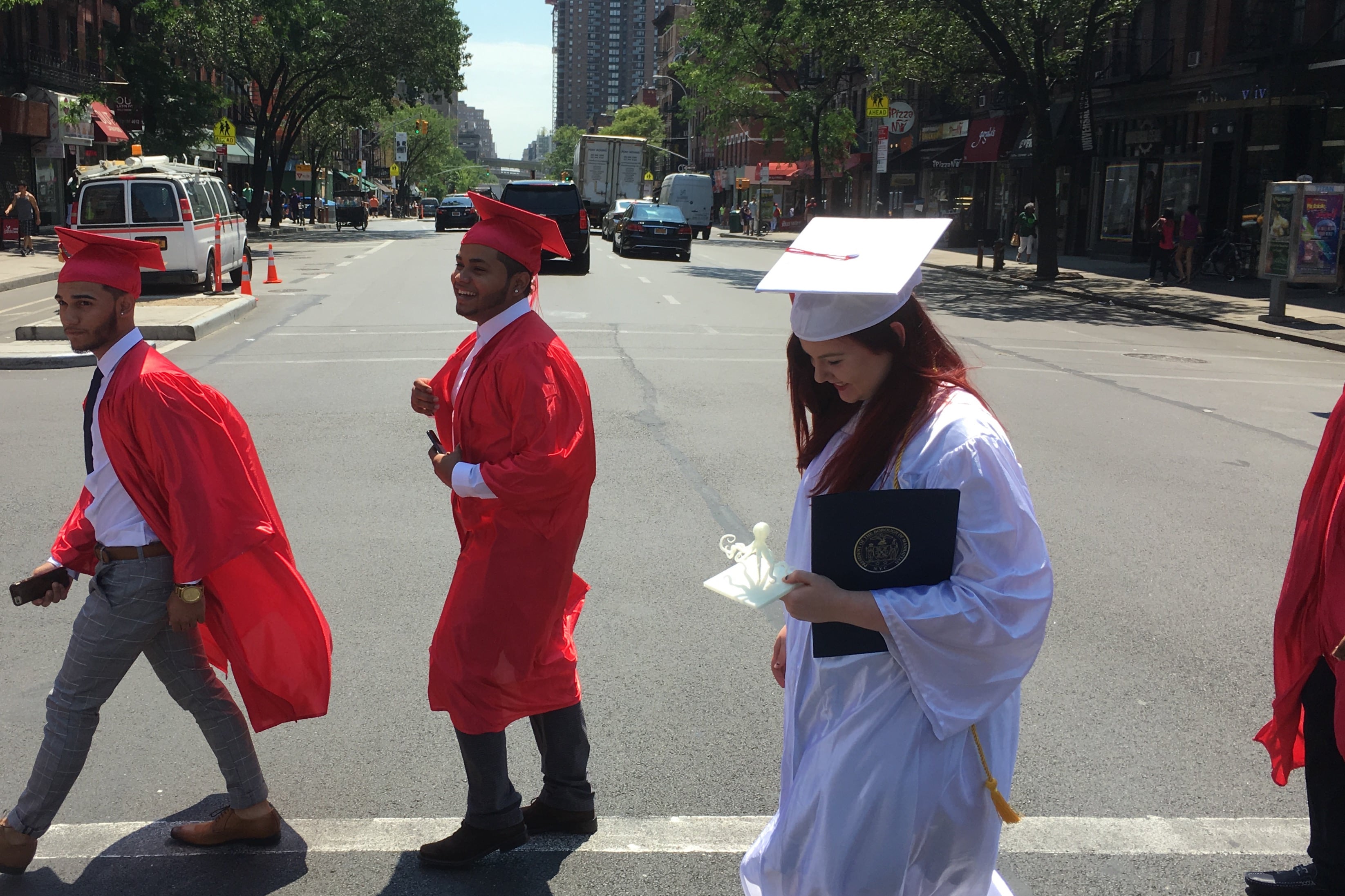Leigh Duignan walks to graduation with classmates from The Urban Assembly Gateway School for Technology.
