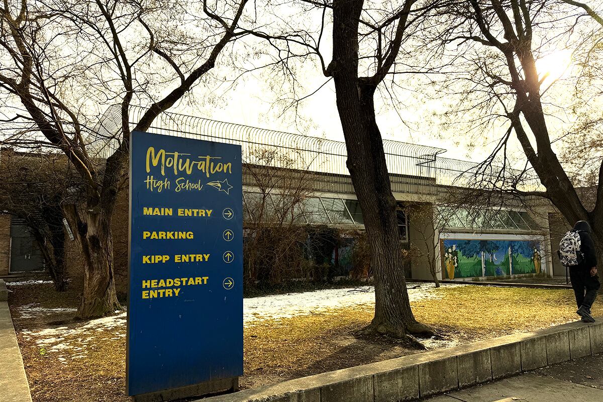 A blue sign in front of a building.
