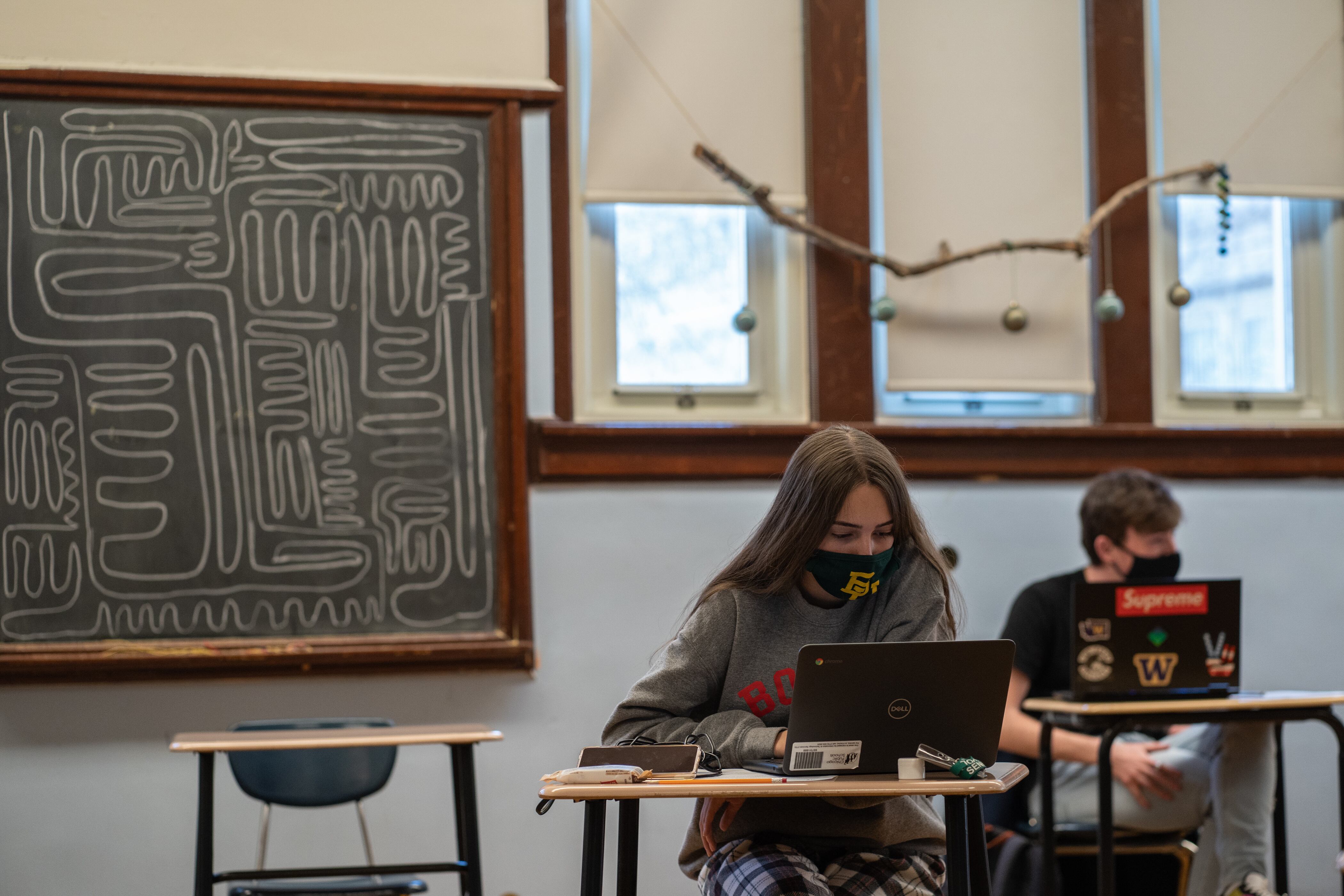 Senn High School seniors work on computers in a history class on the first week back to classrooms for students on April 23, 2021.