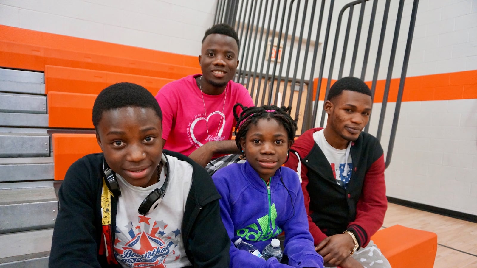 Mbeomo and Tosha Msambilwa with their older brothers. The Msambilwa's are refugees and students at the newcomer school in Indianapolis Public Schools.