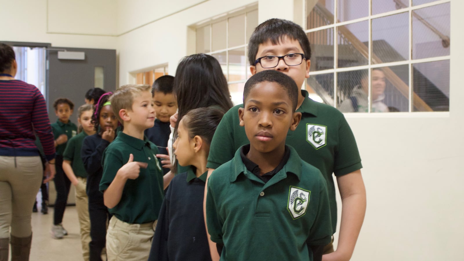 Students line up in the hallway at the Cole Arts and Science Academy in Denver.