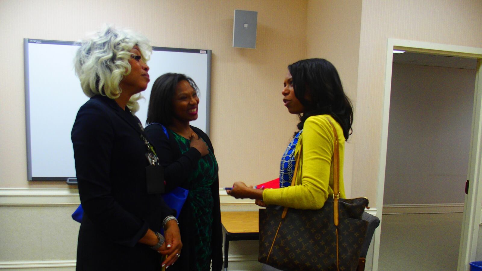 From left: Sharon Griffin, regional superintendent of the Innovation Zone in Memphis, speaks with iZone adviser Ashleigh Dennis and Kameelah Shaheed-Diallo, a vice president with The Mind Trust, a nonprofit education organization based in Indianapolis.