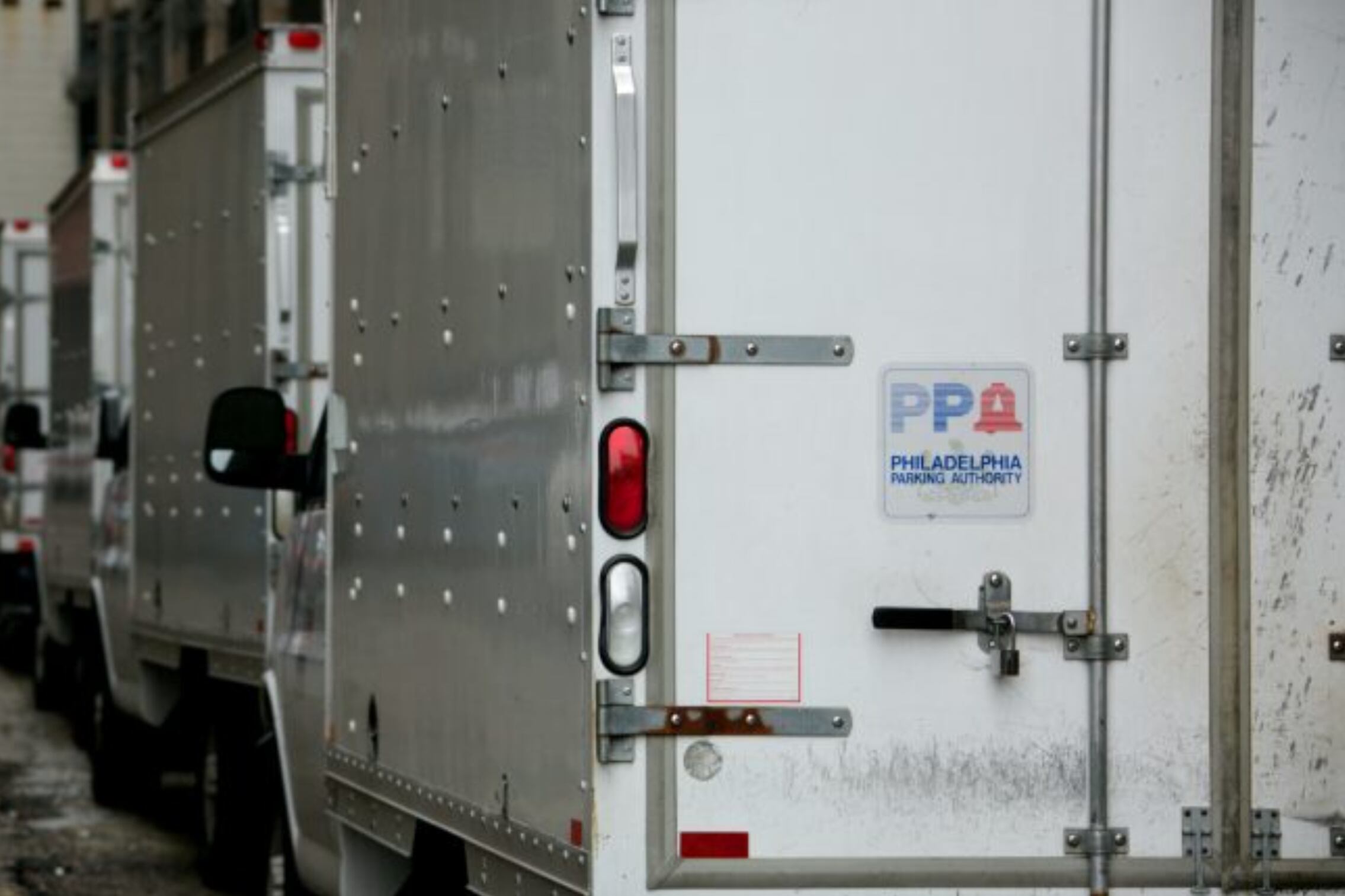 Philadelphia Parking Authority trucks sit in a line.