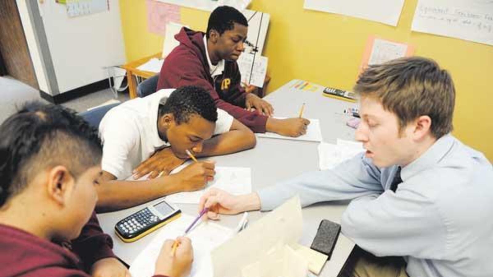 Collegiate Prep Academy ninth-graders work with a math tutor in 2012.