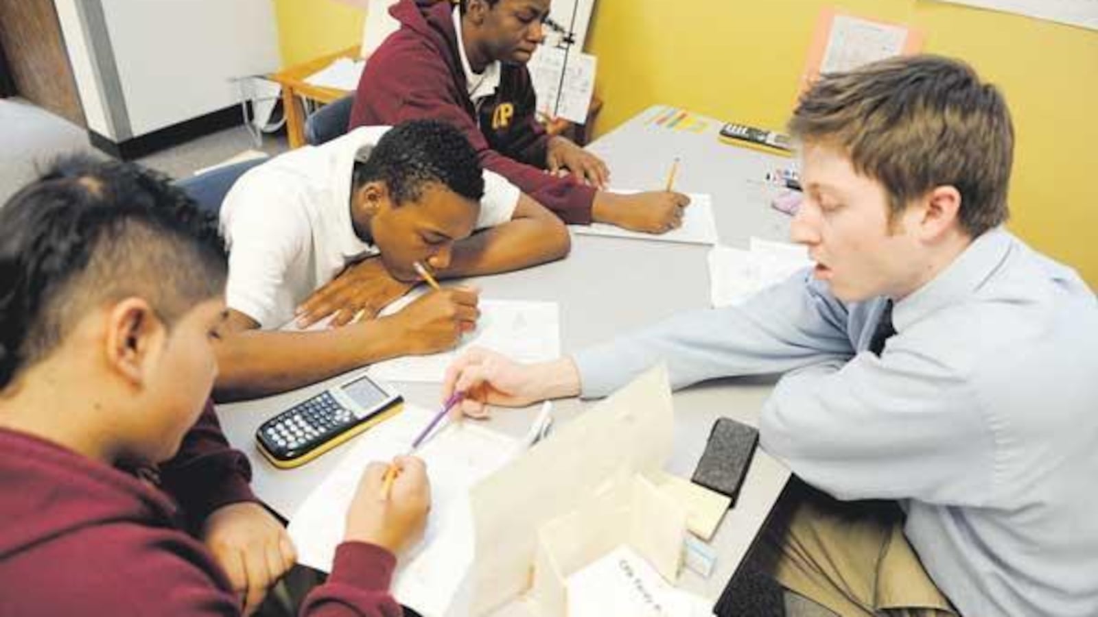 Collegiate Prep Academy ninth-graders work with a math tutor in 2012.