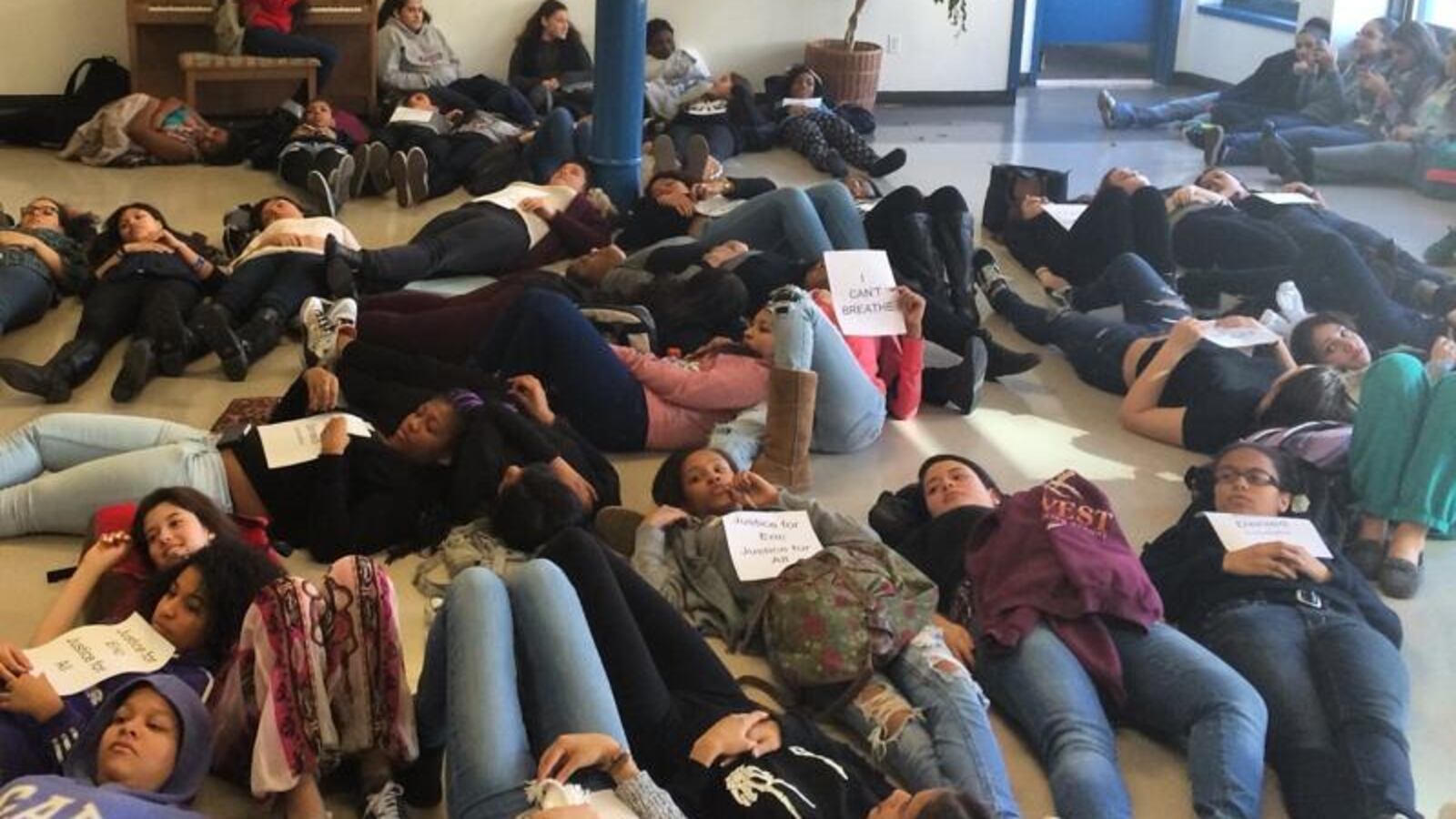 Students at Harvest Collegiate High School stage a demonstration at the school to protest the indictment decision over Eric Garner's death.