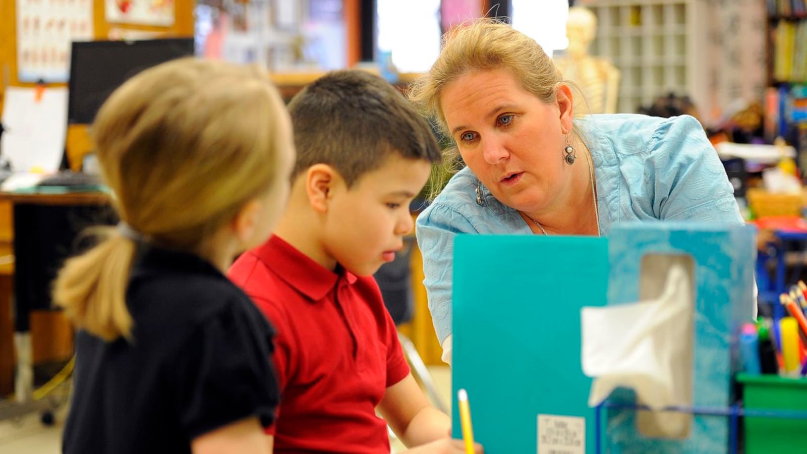 A teacher works with her students at IPS School 27, a Center for Inquiry school.