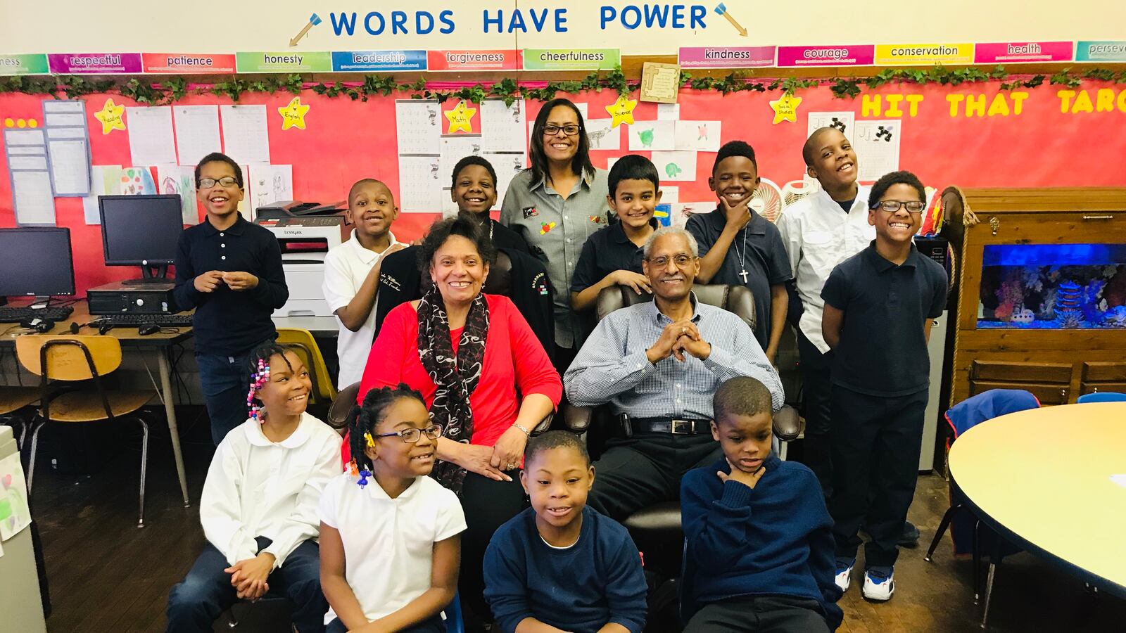 Marla Williams, a special education teacher at Davison Elementary-Middle School in Detroit (center, top row) is pictured with her parents and her students.