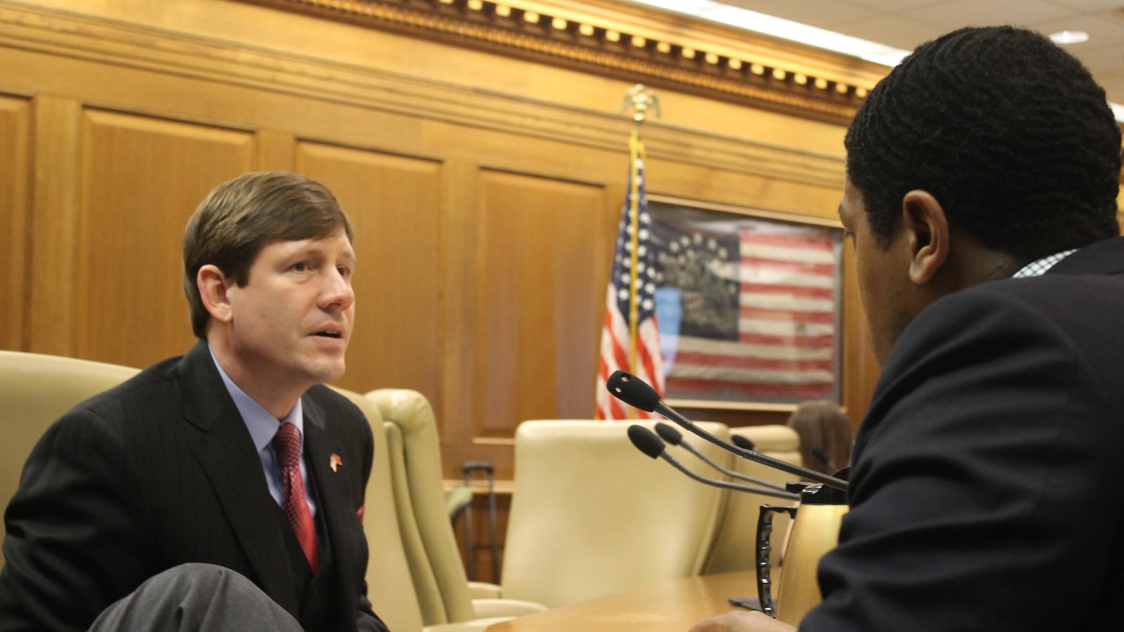 State Sen. Brian Kelsey of Germantown (left) confers with someone before the Senate Education Committee voted March 7 to advance his Memphis-specific voucher bill.