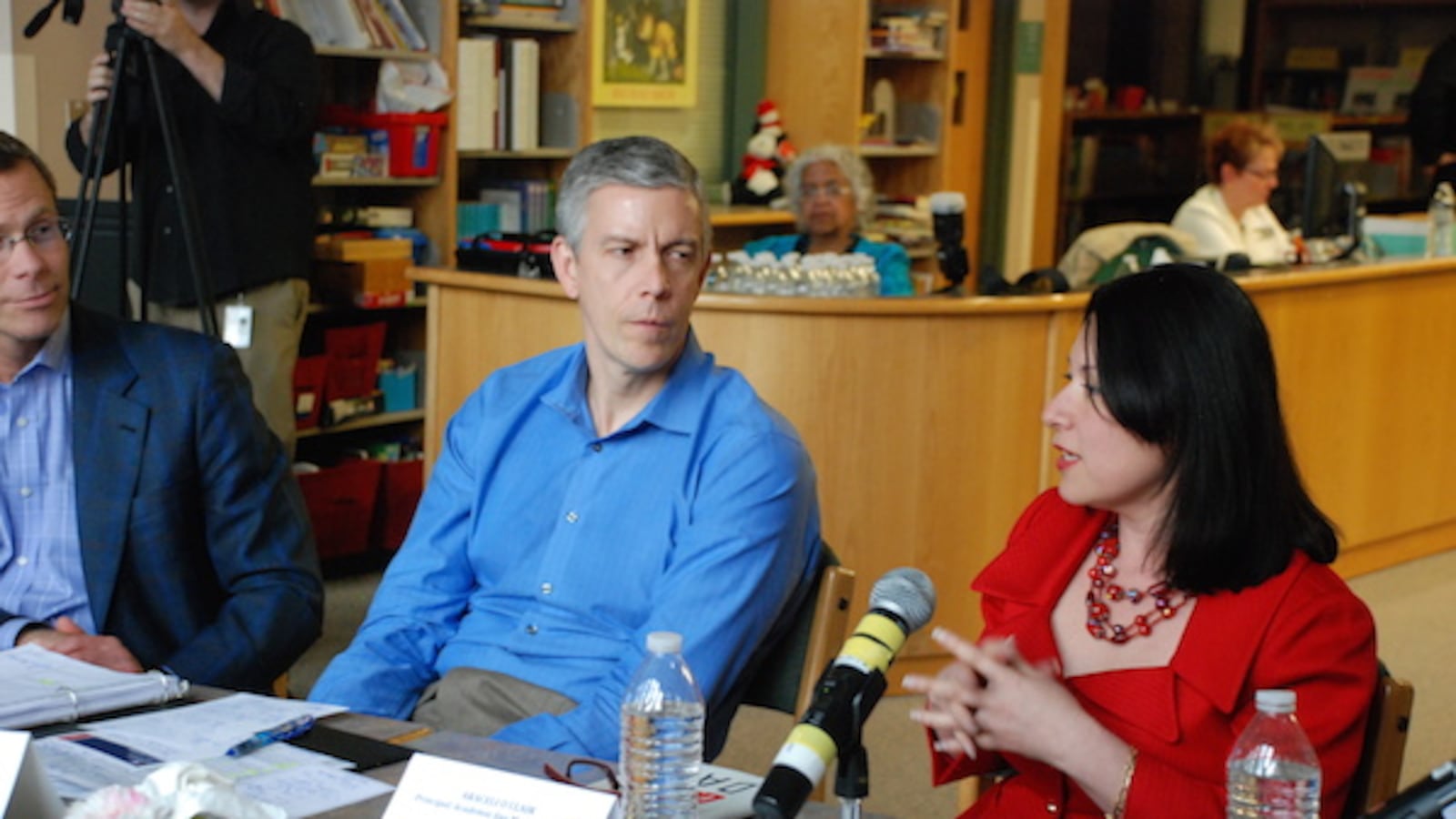 U.S. Secretary of Education listens to Araceli O'Clair, principal at Academia Ana Marie Sandoval in northwest Denver.