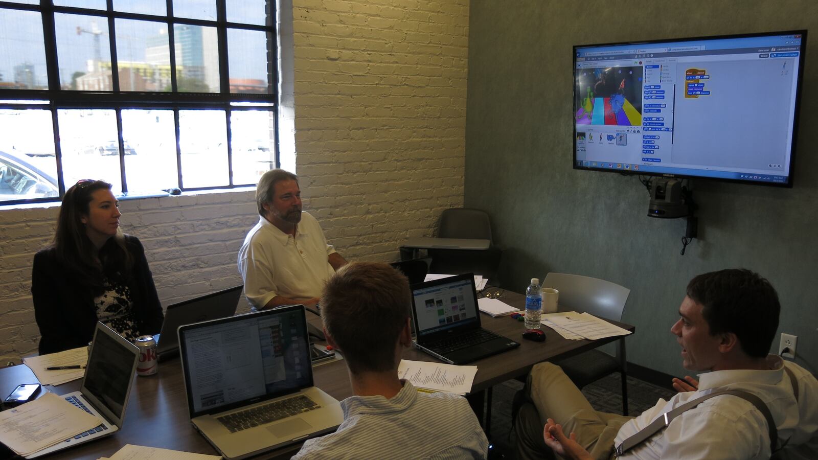 Educators from RePublic Schools, Bailey STEM, and Apollo Middle Prep go over a computer programming curriculum at the Nashville Entrepreneur Center.