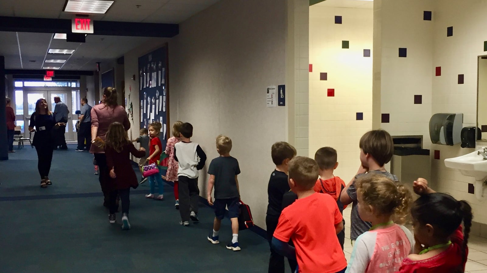 Kindergartners walk down the hallway at South Creek Elementary School.
