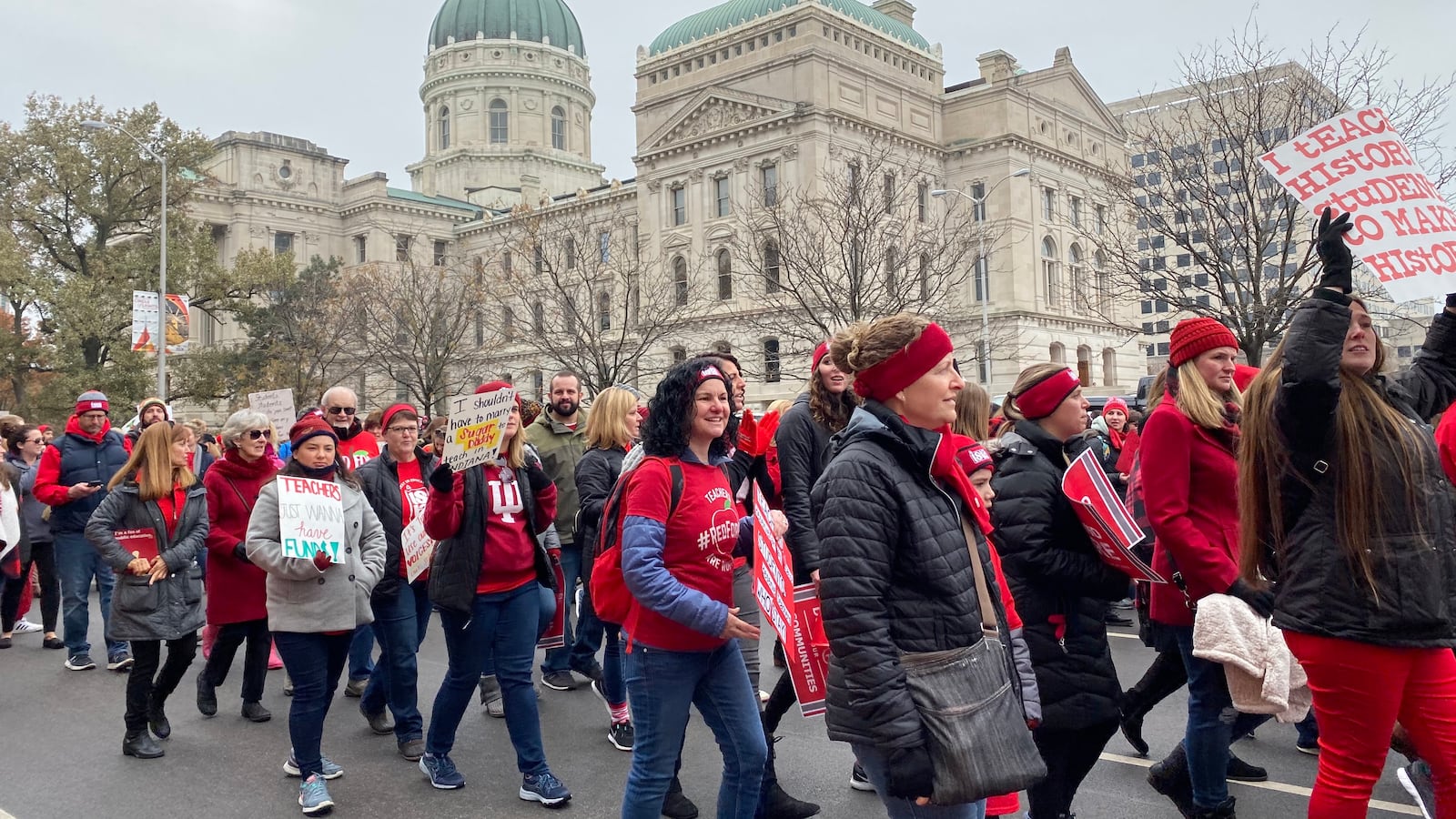 Red for Ed supporters march up Capitol Avenue around the Indiana Statehouse on Tuesday, Nov. 19, 2019.
