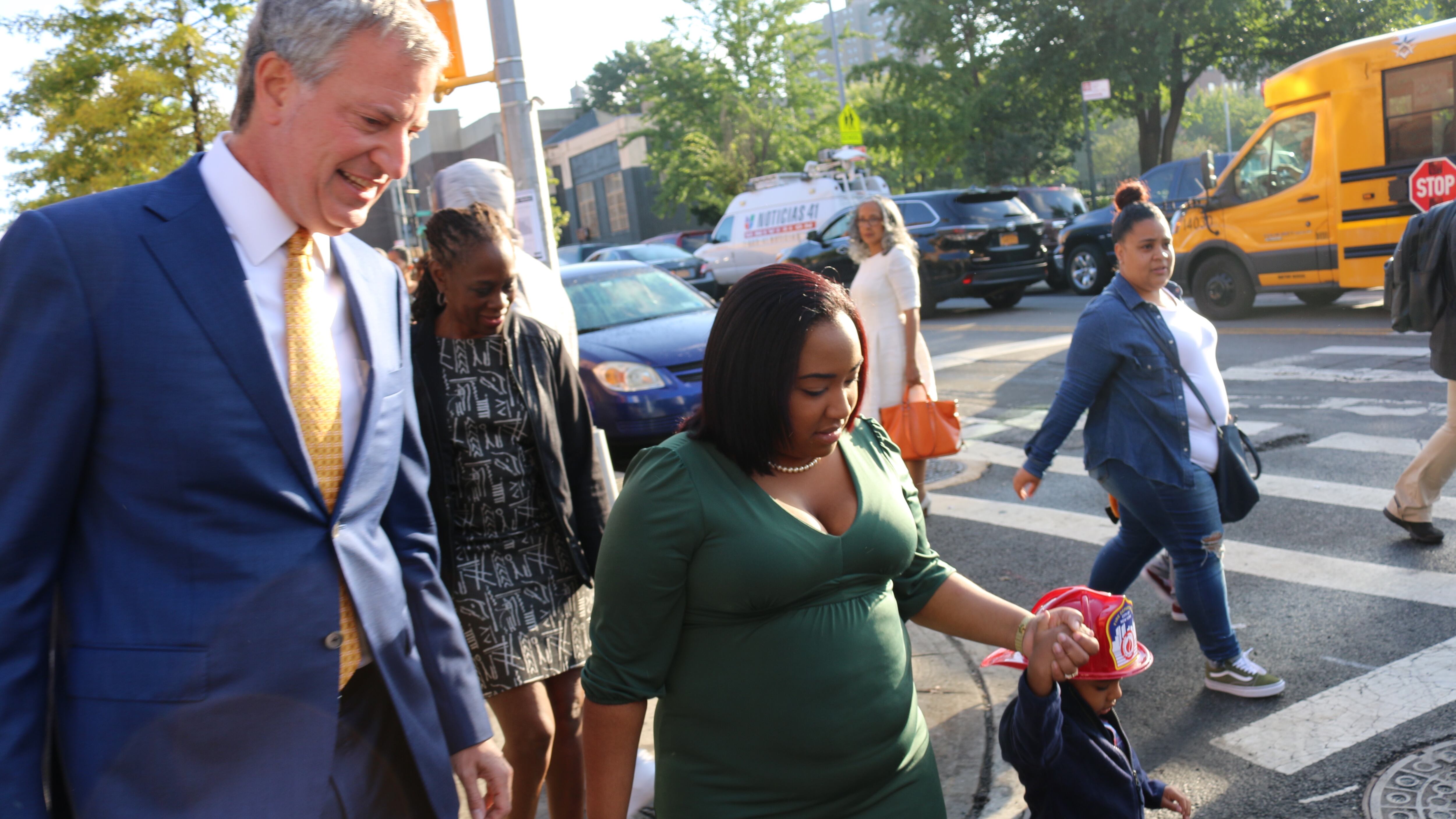 Mayor Bill de Blasio walks to P.S. 277 in the Bronx with three-year-old Joel Lopez and his mother, Astrea Ramirez, on the first day of school last year.