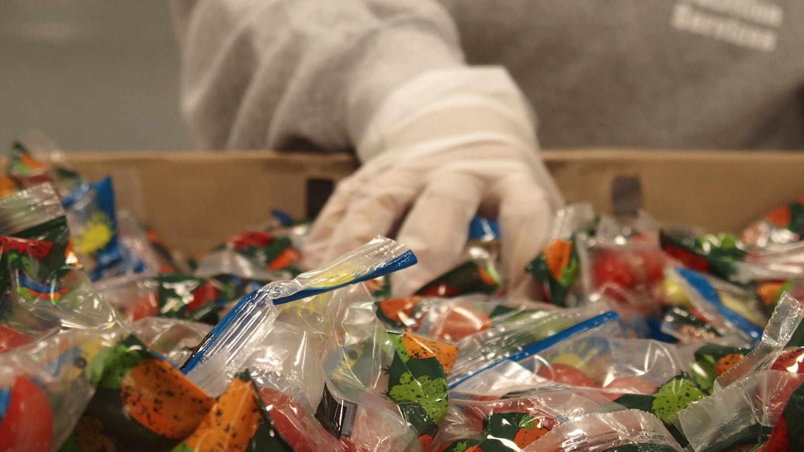 Shelby County Schools staff prepare to-go lunches for students while school is closed over concerns of the new coronavirus spreading.