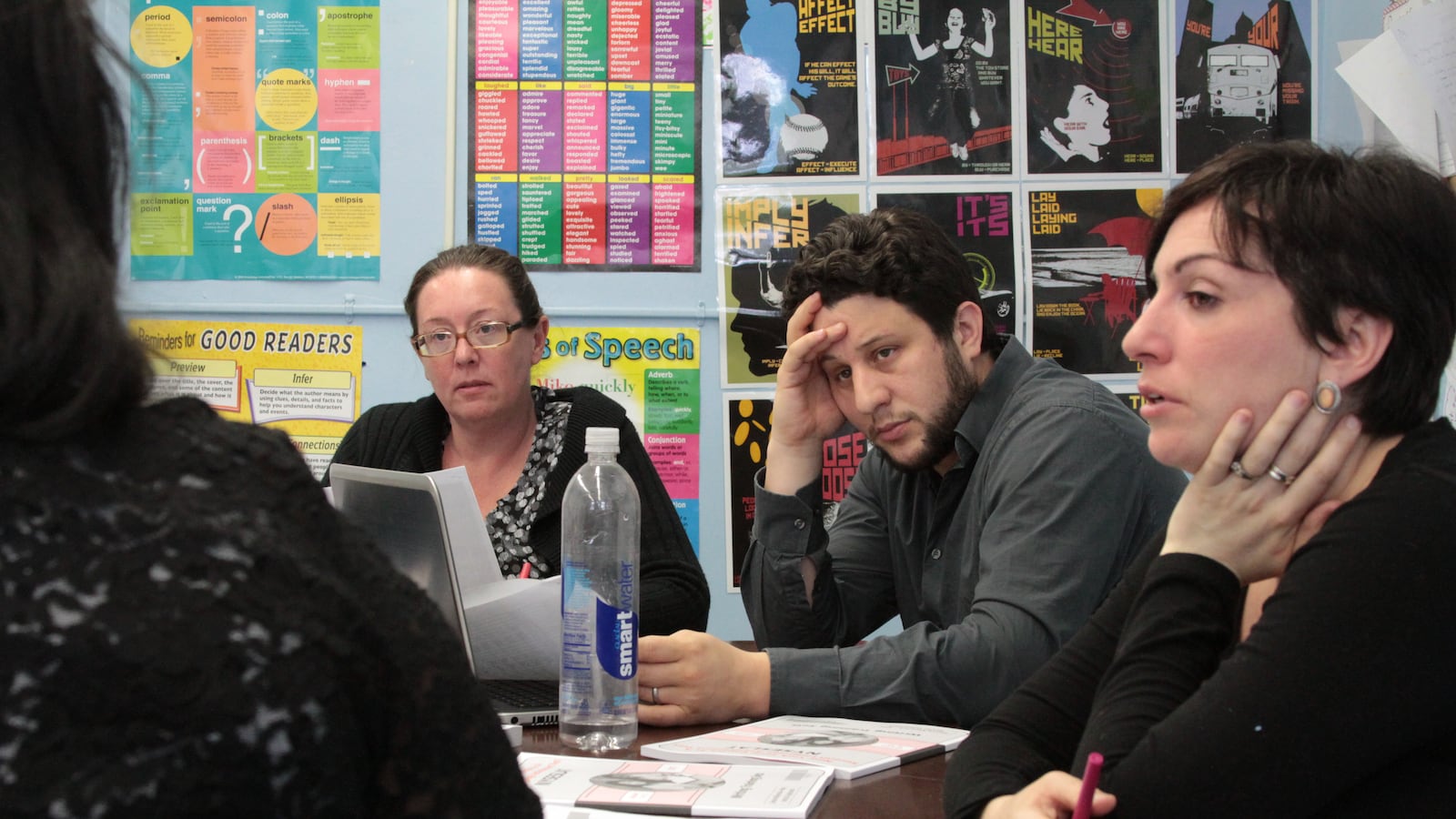 Brooklyn Generation School teachers Louise Bogue (left), Neil Garguilo and Kaylan Buendia (right) speak with Michele Hill, the school’s college and career program director.