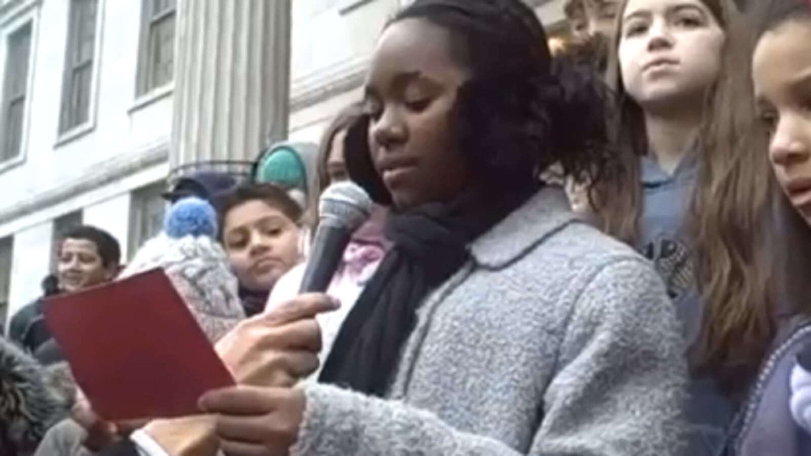 A student at P.S. 261 in Brooklyn recites part of Martin Luther King's "I have a dream" speech during the school's march on Friday.