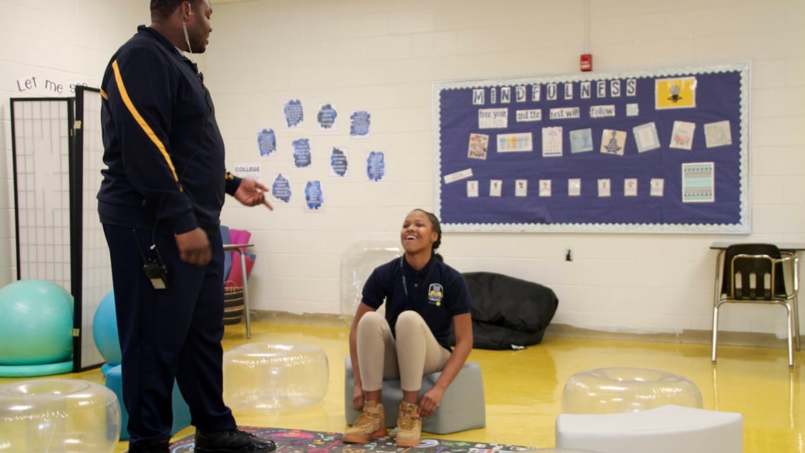 At Kirby Middle School, Rolander Mann (left) went from managing in-school-suspension to staffing the reflection room, a restorative justice effort.
