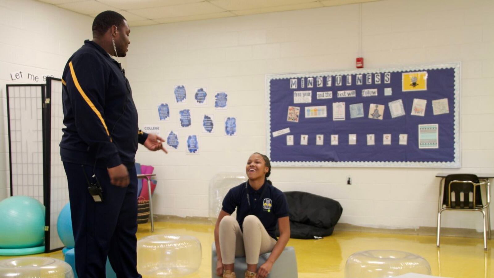 At Kirby Middle School, Rolander Mann (left) went from managing in-school-suspension to staffing the reflection room, a restorative justice effort.